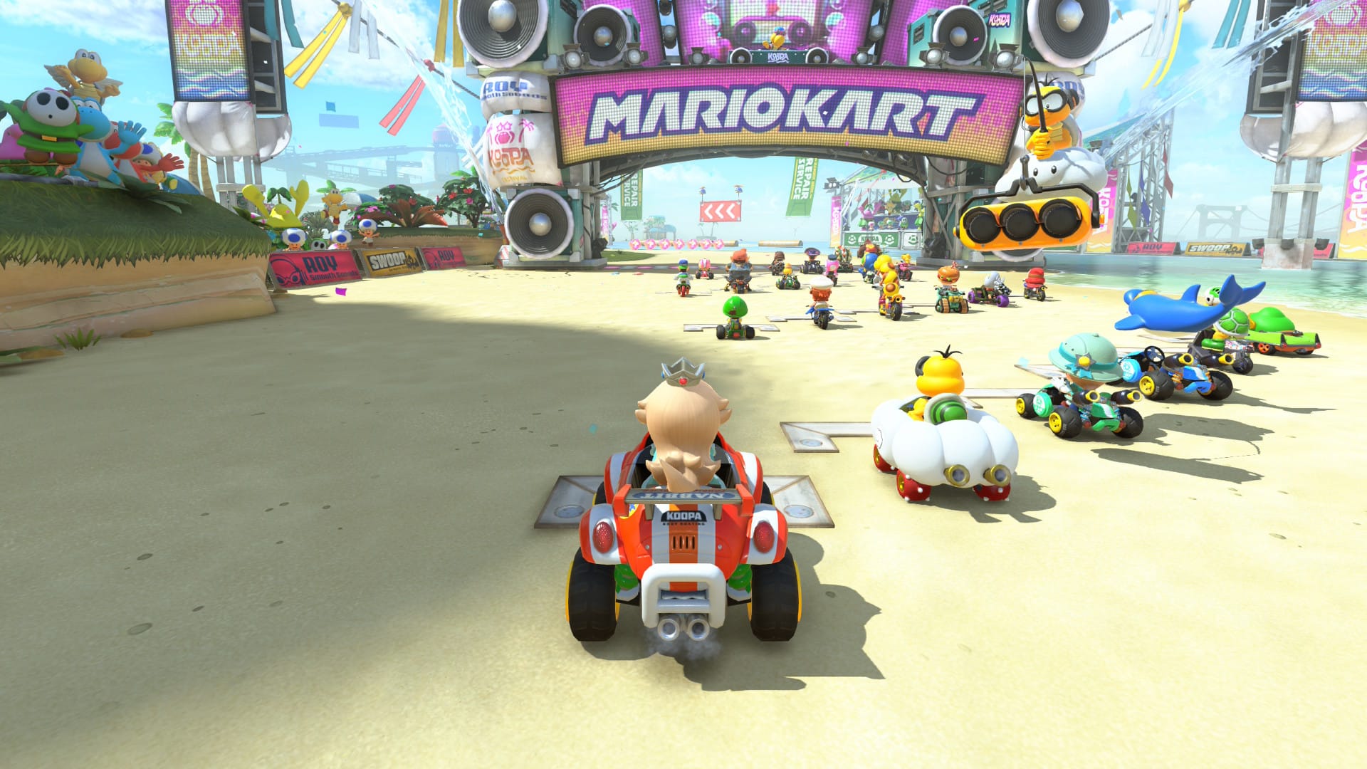 Daisy in an orange truck at the start of a race in Mario Kart World running on a Switch 2.