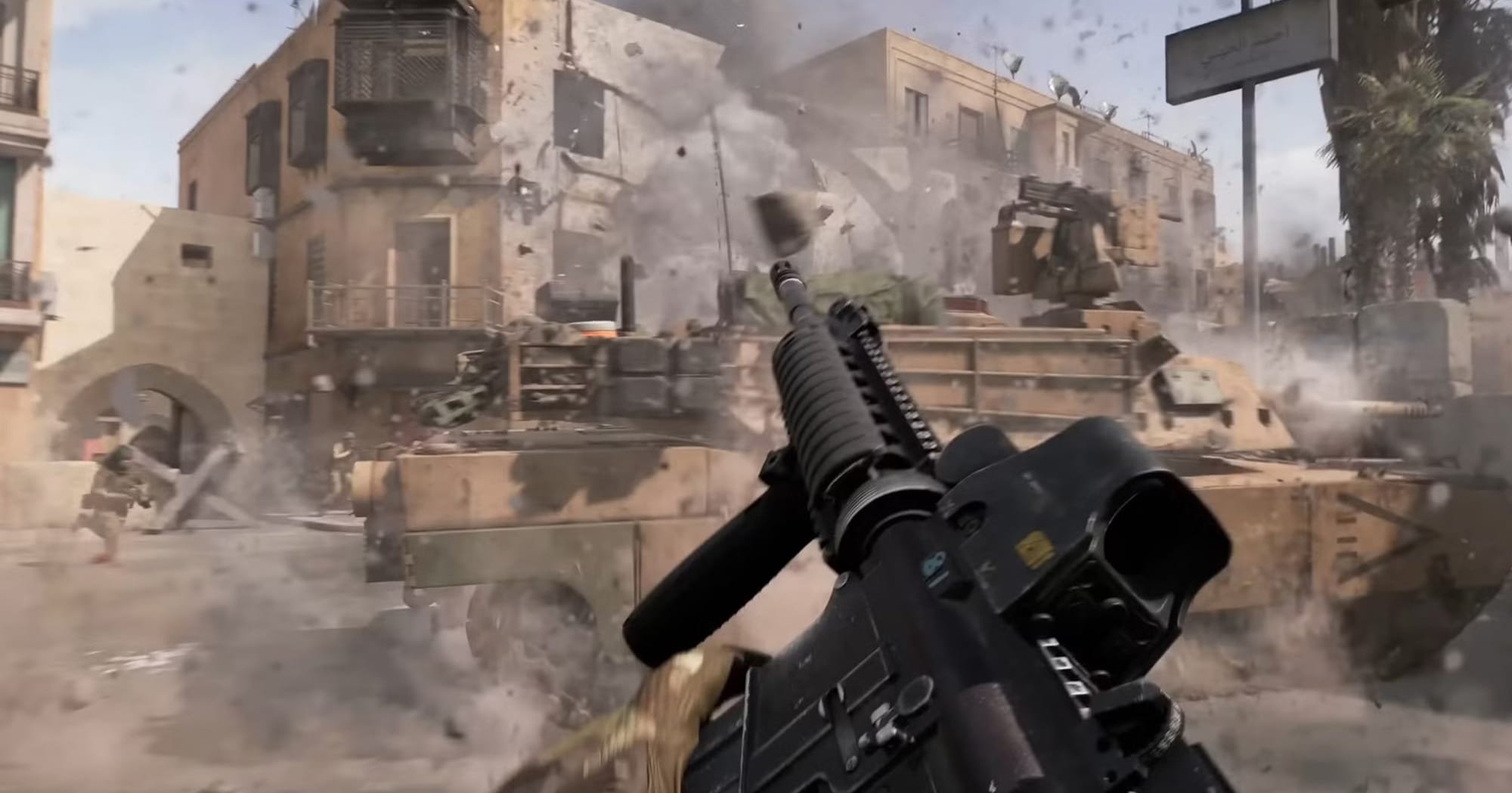 Footage from the gameplay teaser of BF6. A tank drives past a reloading soilder while building explode.