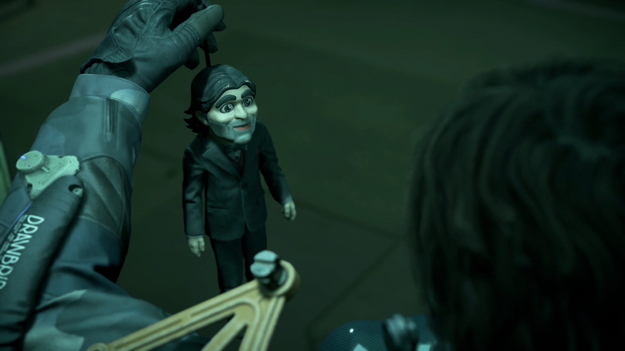 Sam holding Dollman (Faith Akin/Jonathan Roumie) in Death Stranding 2.