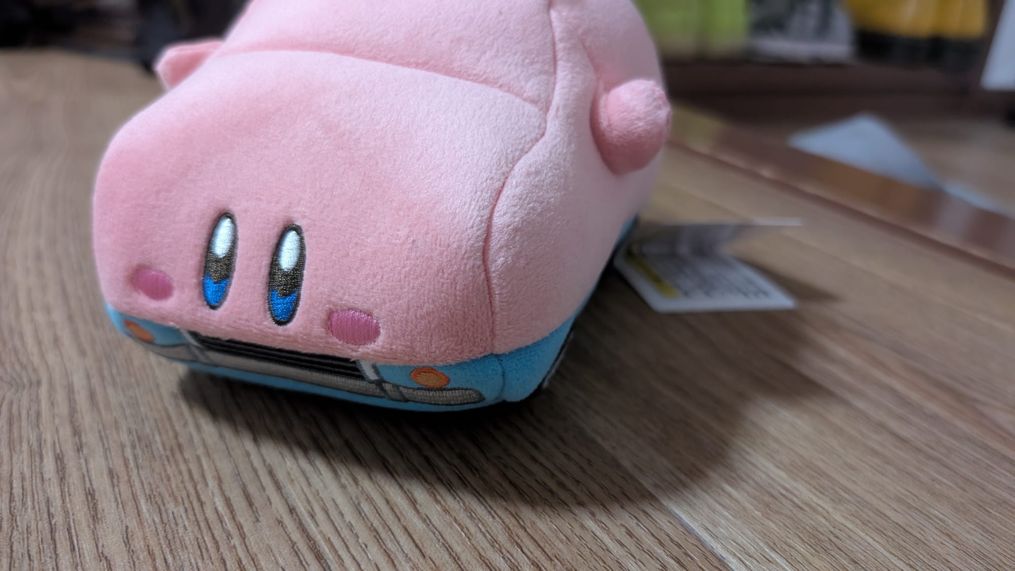 A Plush of Carby, Kirby who has half swallowed a car.