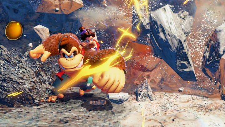 Donkey Kong punching through now destroyed rocks with a small girl on his shoulder